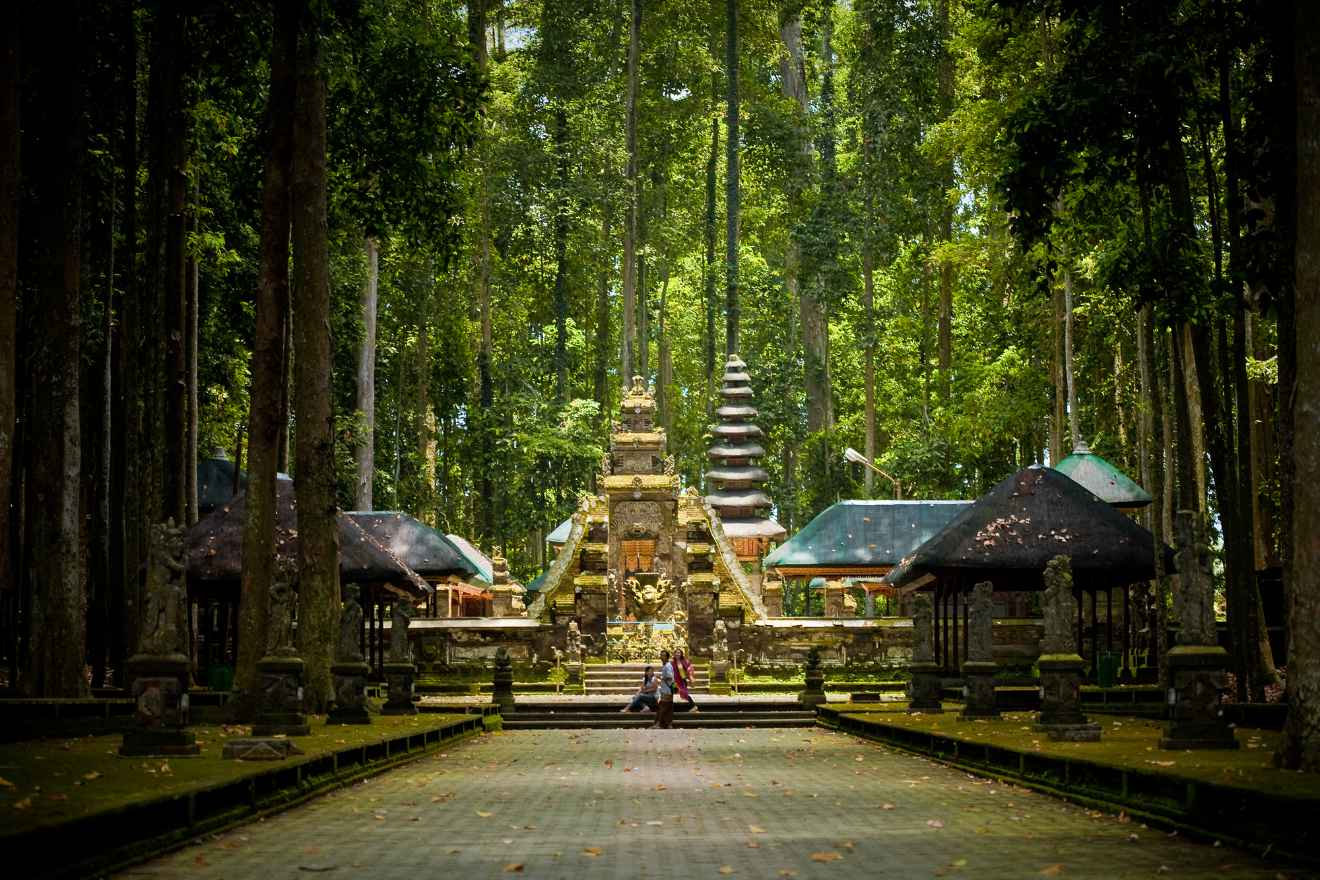 A temple in the middle of a wooded area.