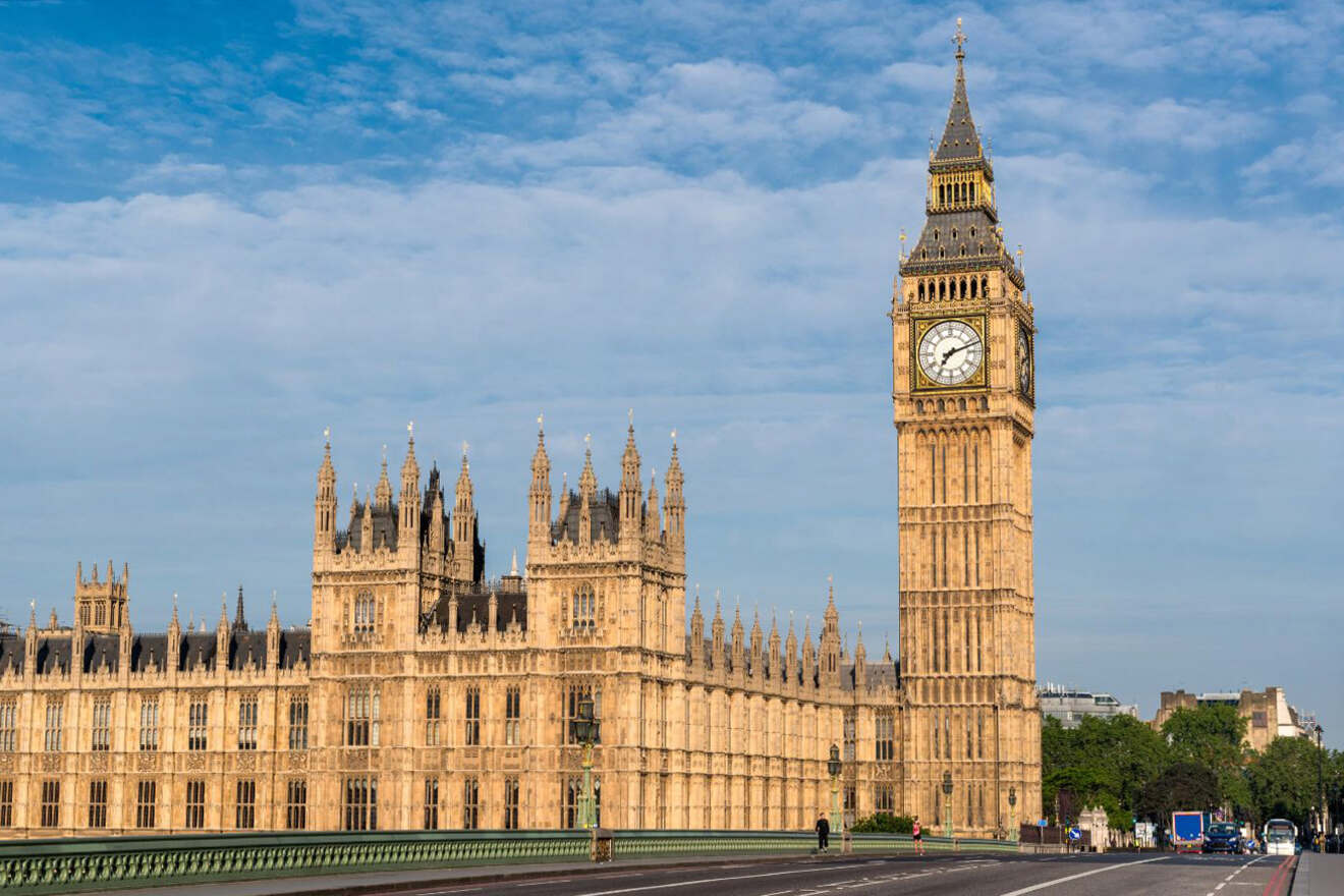 The image shows the Elizabeth Tower, commonly known as Big Ben, part of the Palace of Westminster in London, with a clear blue sky in the background.