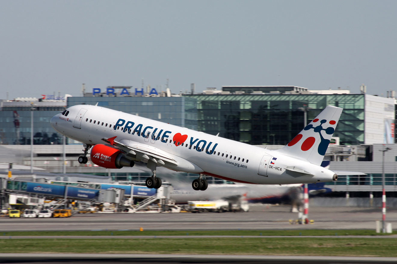 an airplane with a sign saying "Prague (heart) you"