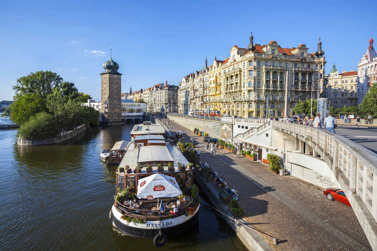 A boat docked on a river in prague, czech republic.