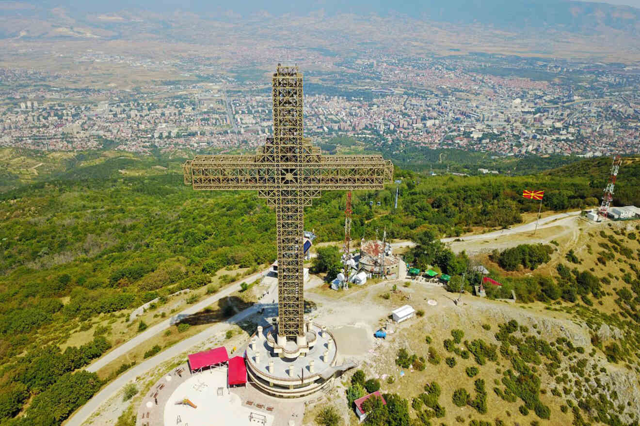 a large cross on top of a hill
