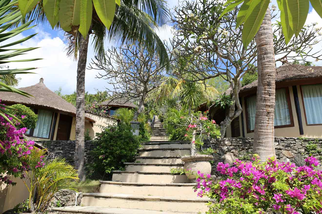 resort with a courtyard of lush palms and flowering plants at Lembongan Island Bali Indonesia