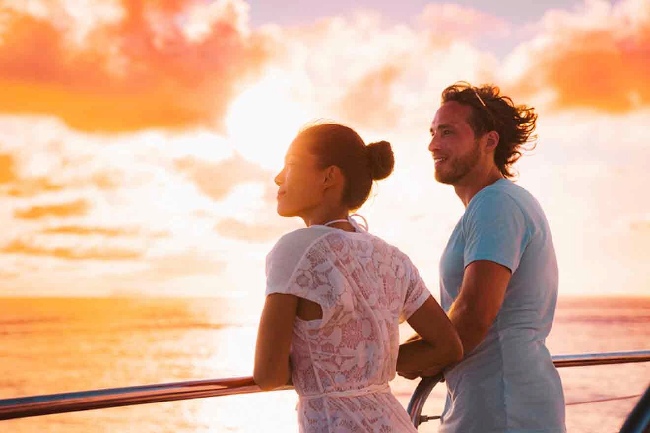 man and woman enjoying the sunset from a cruise