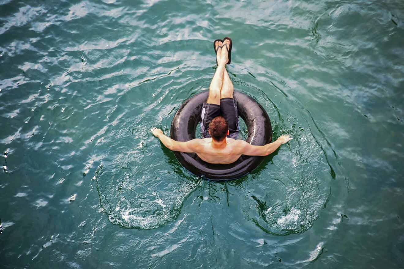 man tubing on a river