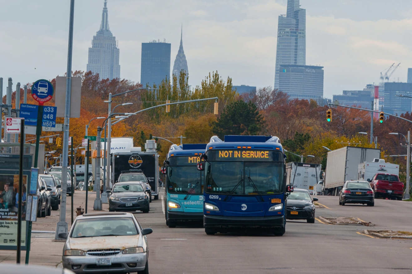 busy street with cars and busses