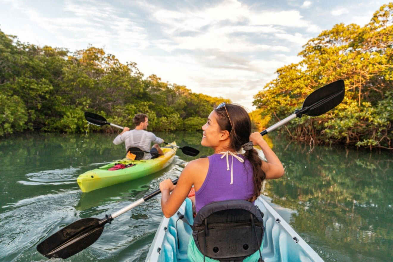 couple kayaking through the mangrove forest 