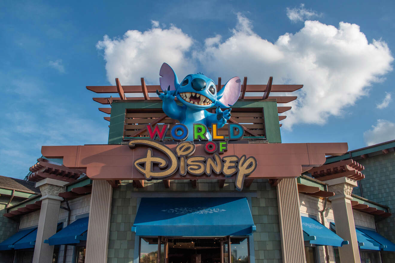 Disney store Sign and statue of Stitch