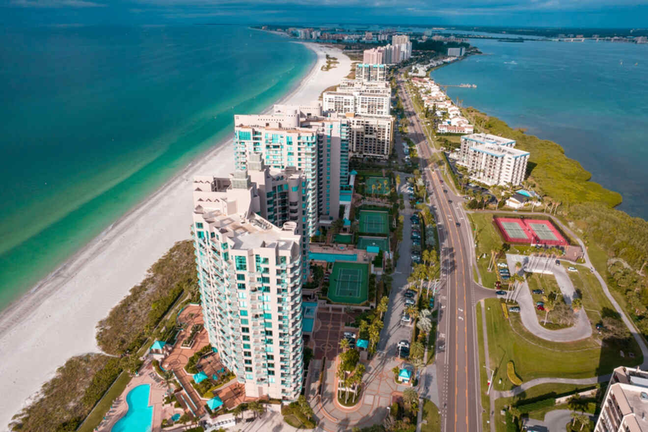 aerial view of coastline with houses and sandy beach