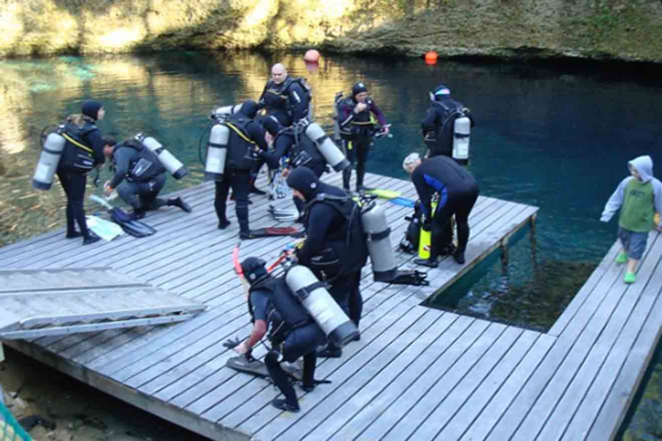 scuba divers getting ready for a dive