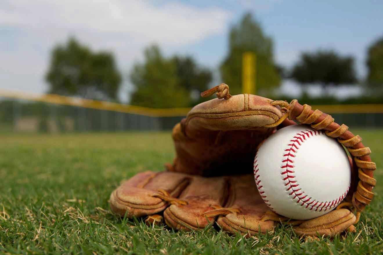 baseball glove and ball on a field