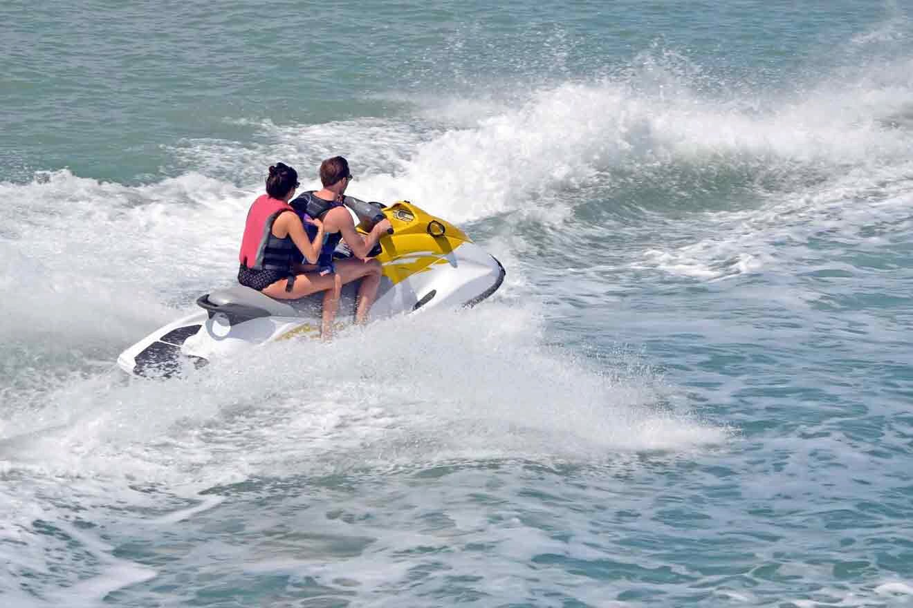 A couple jet skiing