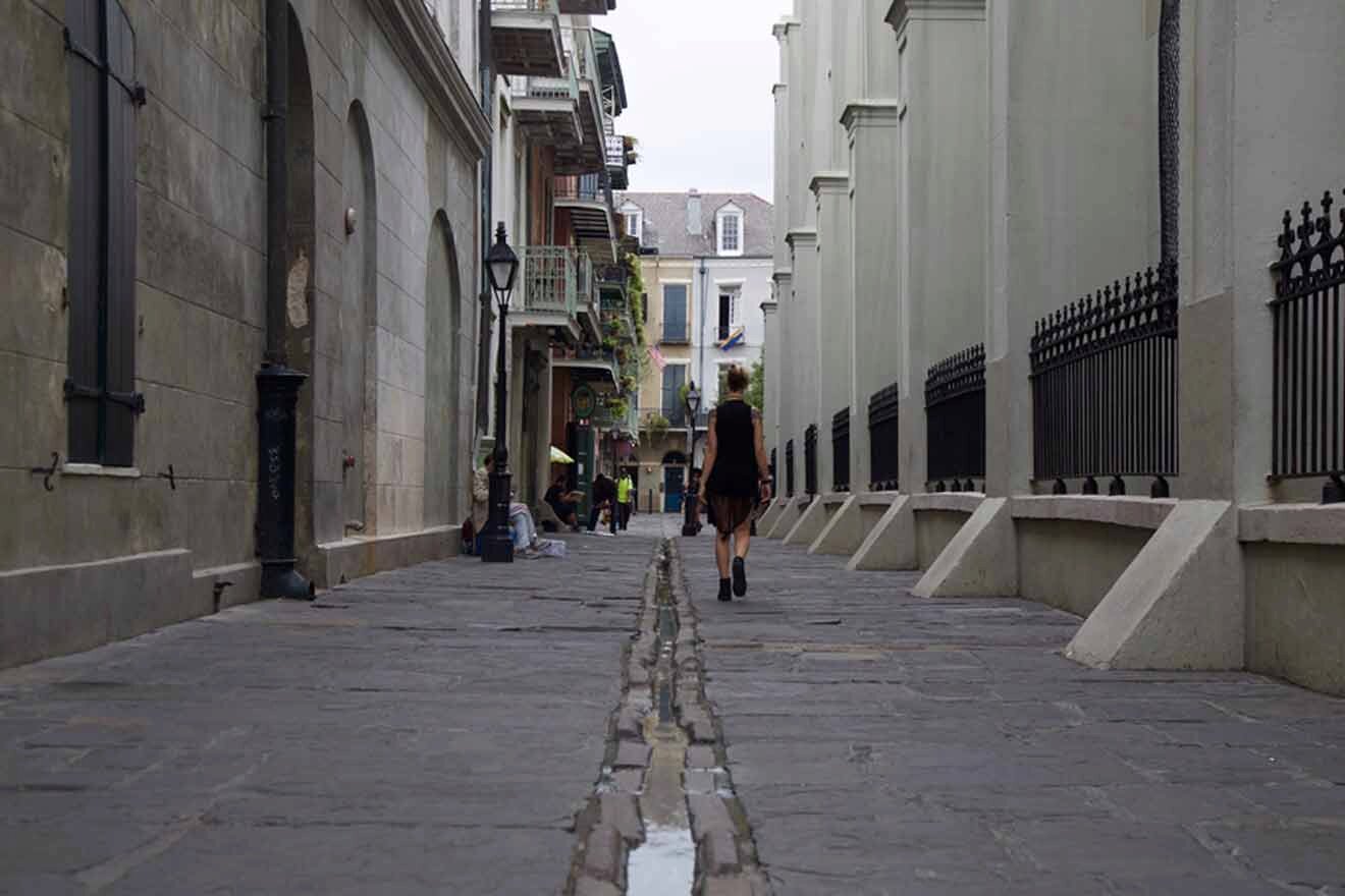 woman walking down on Pirates Alley