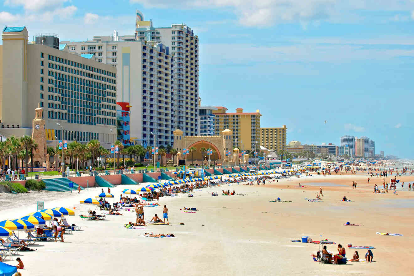 beach front with people, hotels and other buildings