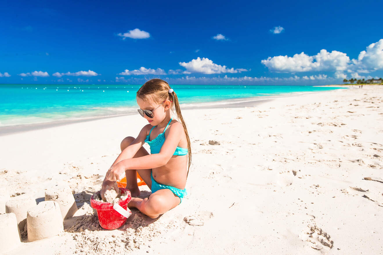 little girl playing on the beach 