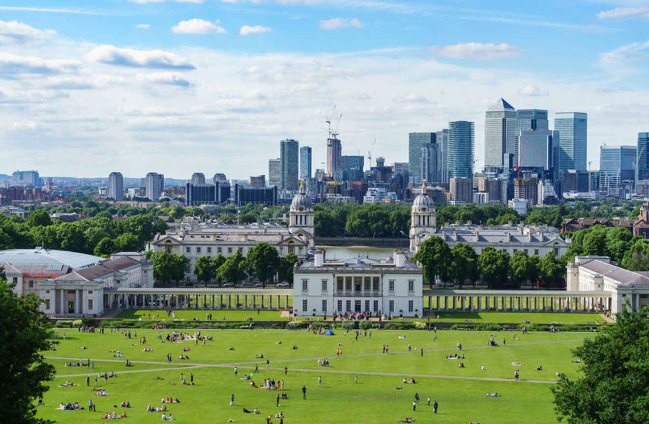 View of people taking a stroll in Greenwich park in front of the Old Royal Naval College in London