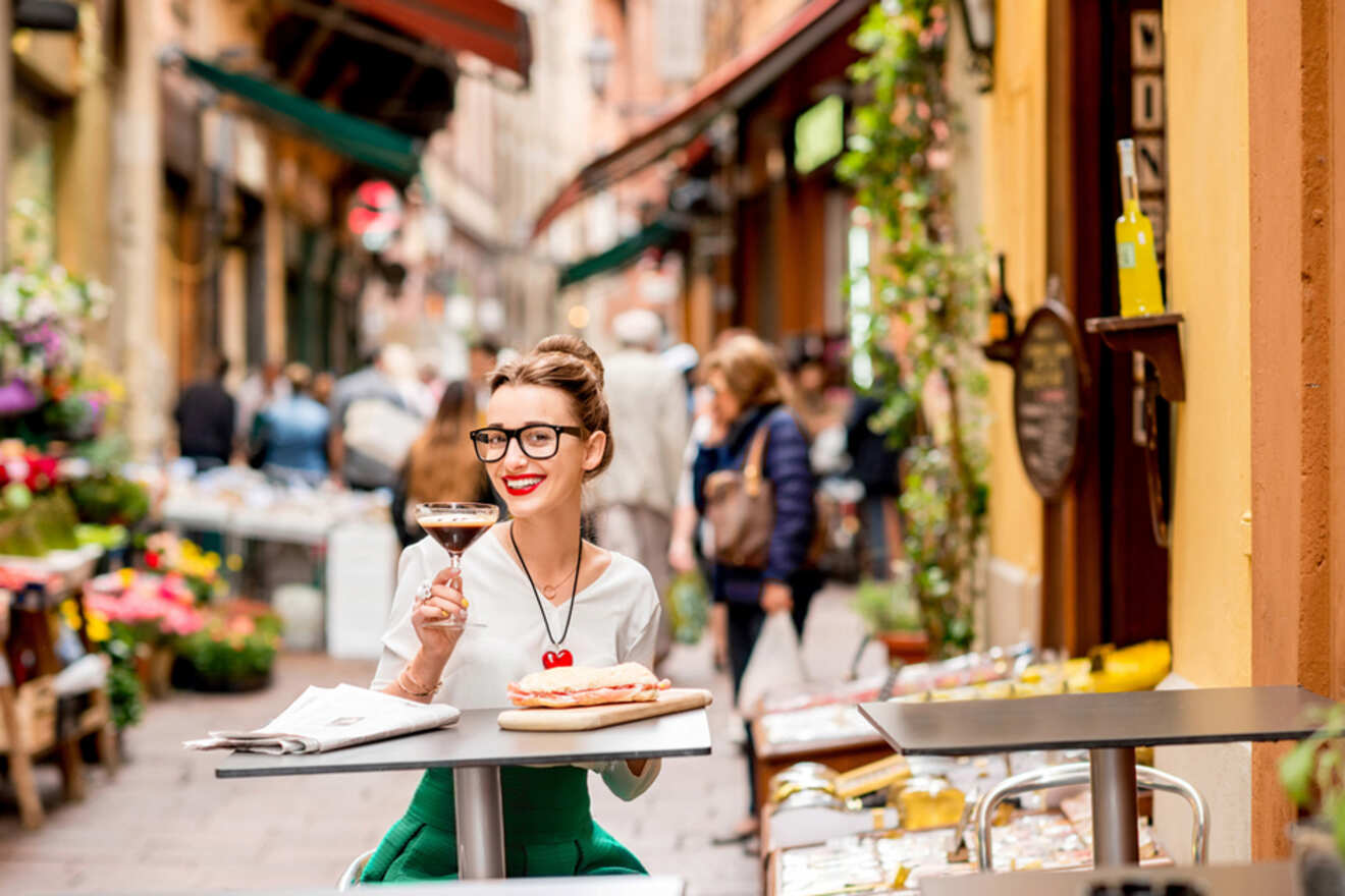 Woman enjoying food on a street in Bologna