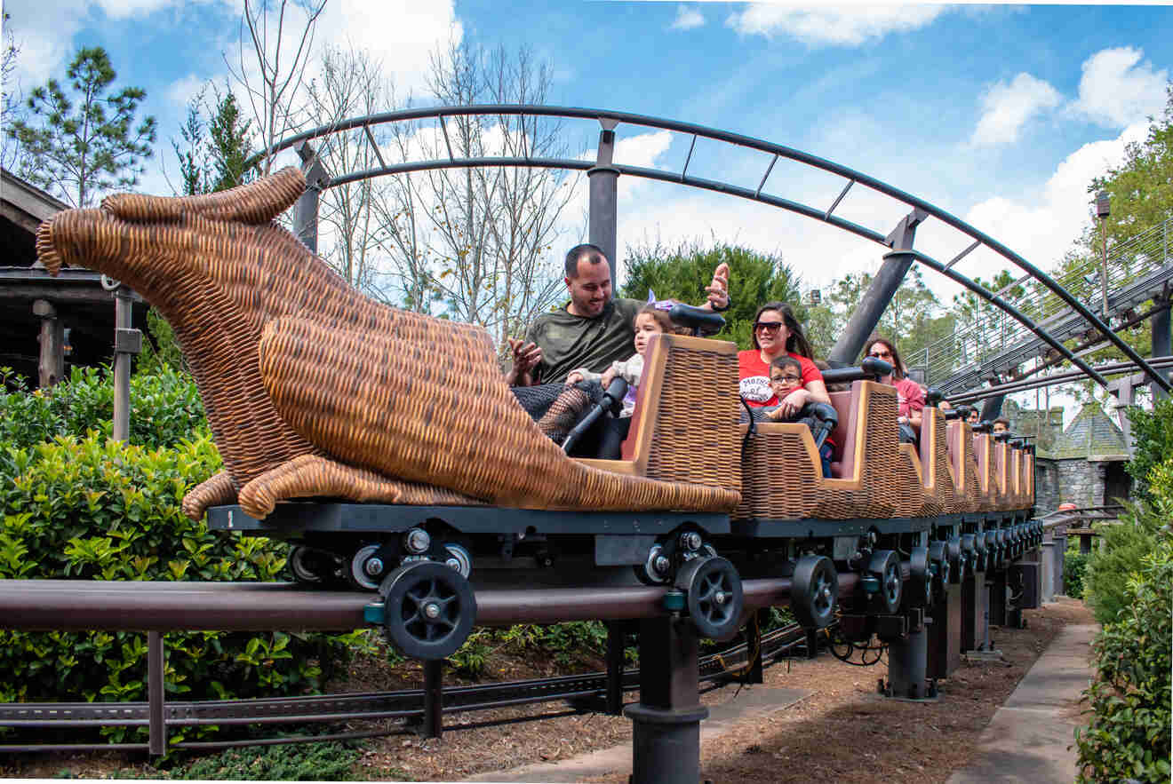 Kids and adults riding on Flight of the Hippogriff ride