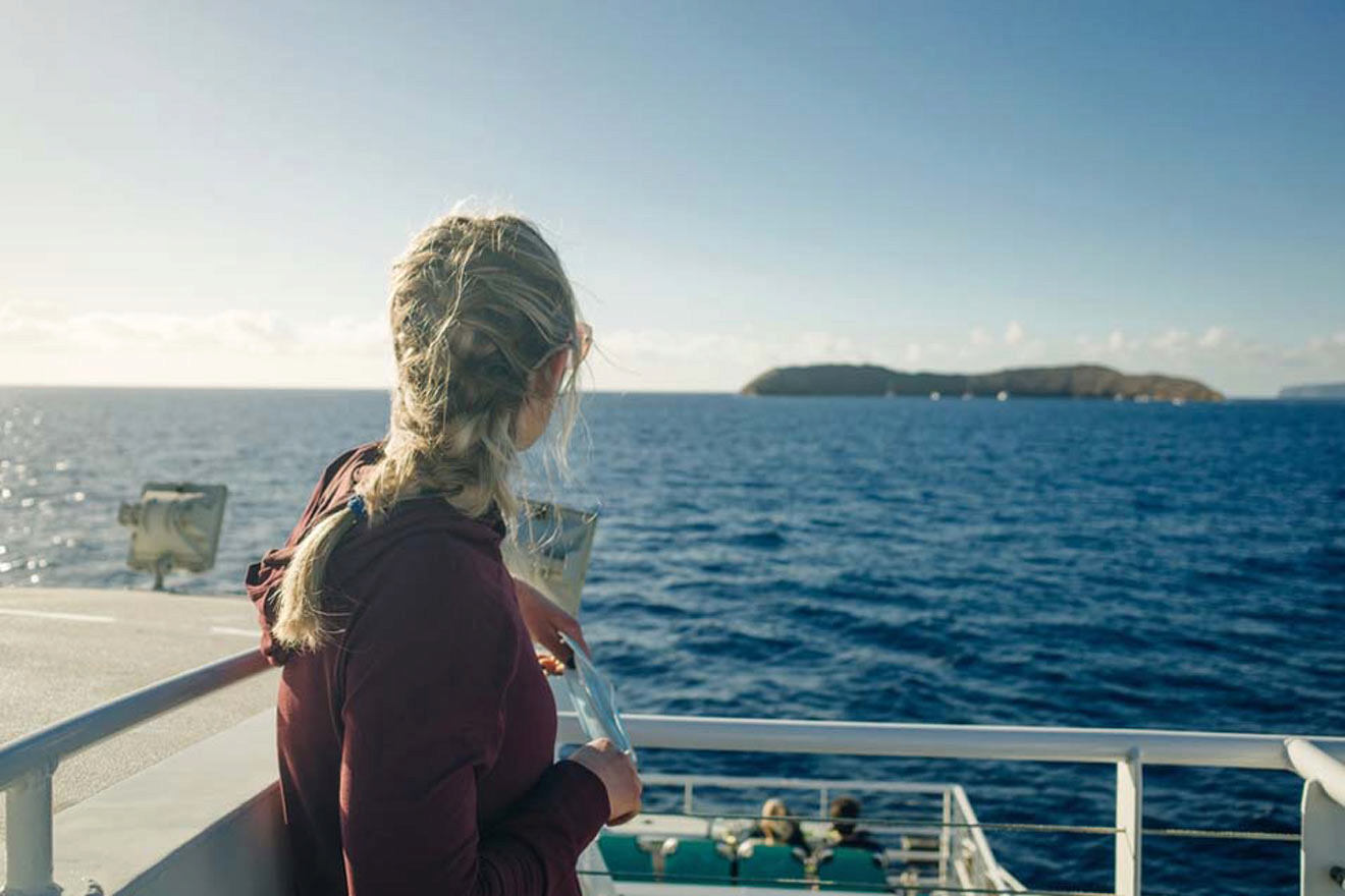 woman on a cruise boat watching over the view