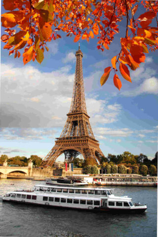 cruise boat on Seine and Eiffel Tower in the background