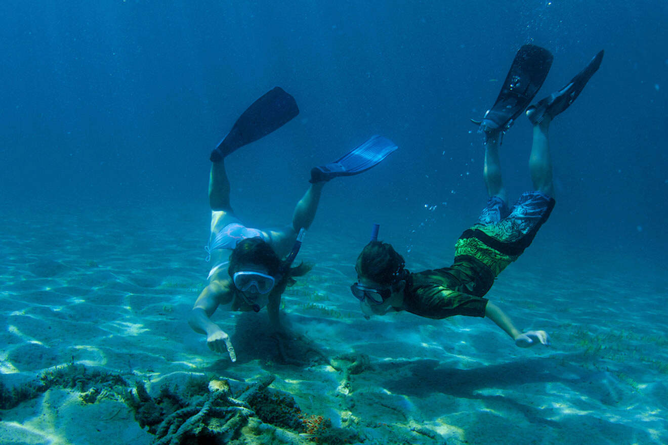 a couple of scuba divers under water
