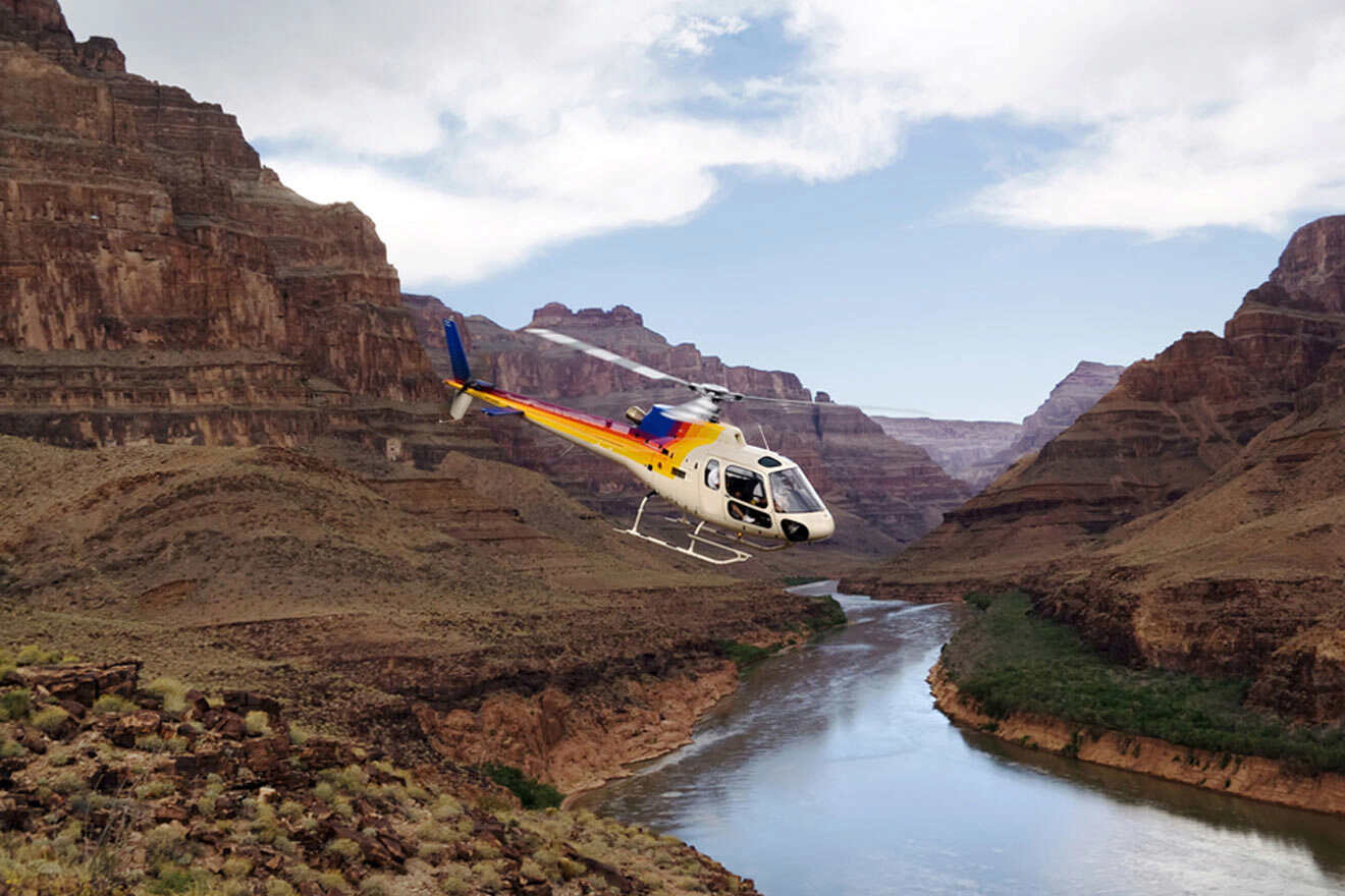 helicopter flying over the Colorado river at the Grand Canyon