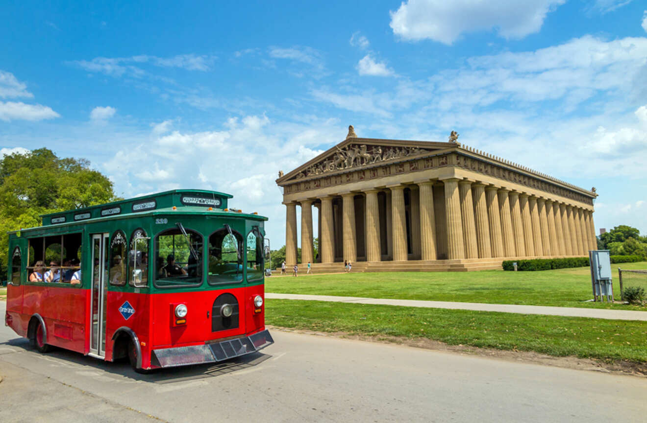 View of the trolley riding next to the Nashville Parthenon
