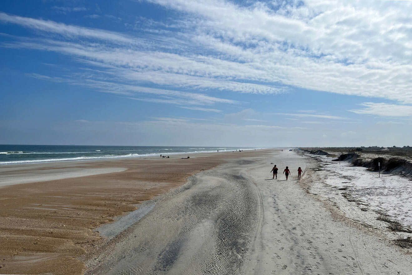 morning at the beach and people running 