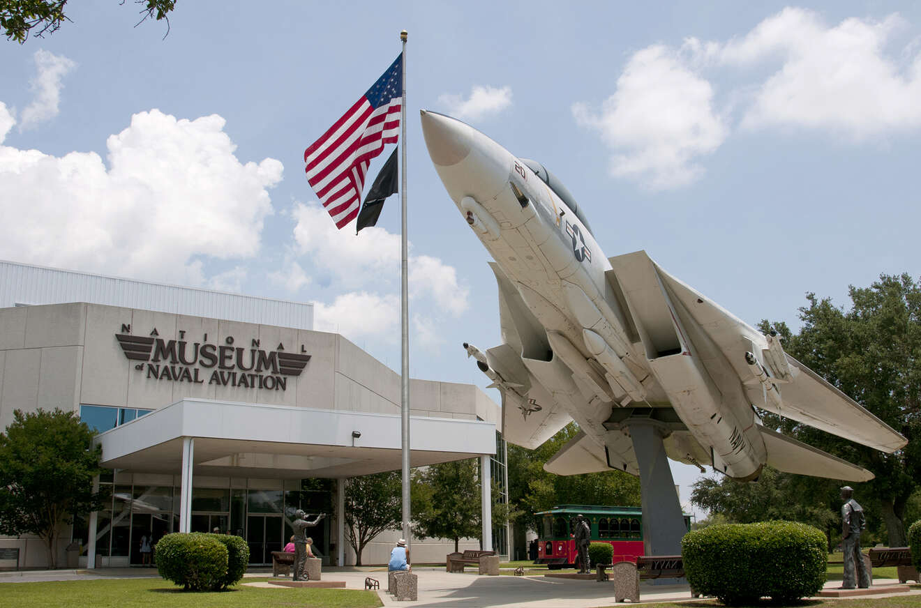 The entrance to National Naval Aviation Museum with an old airplane in front of it