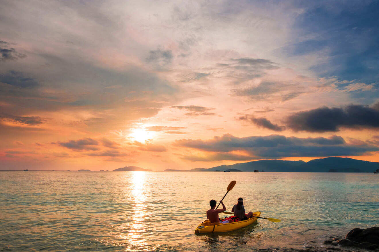 couple kayaking at sunset