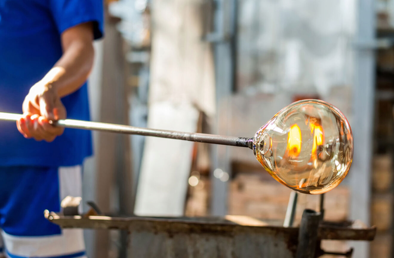 A person blowing glass