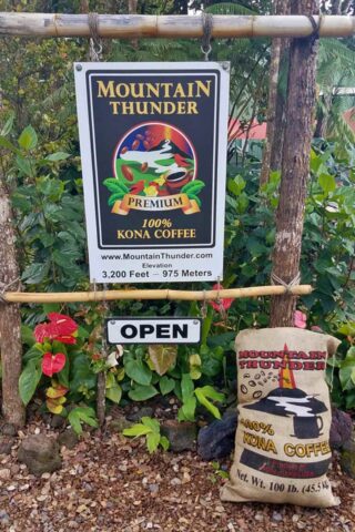 Mountain Thunder sign and a bag of Kona coffee