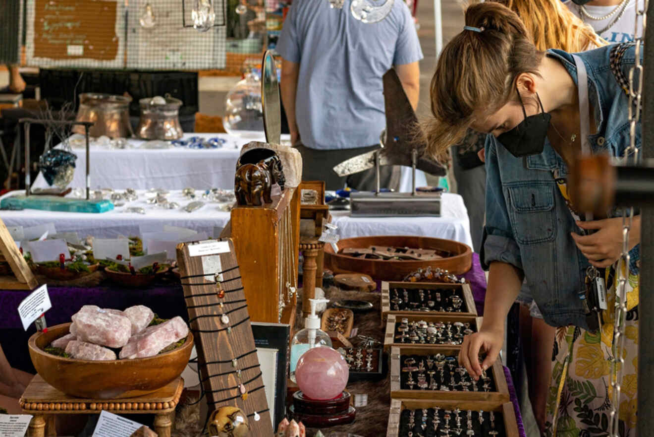 A woman shopping for rings at the market