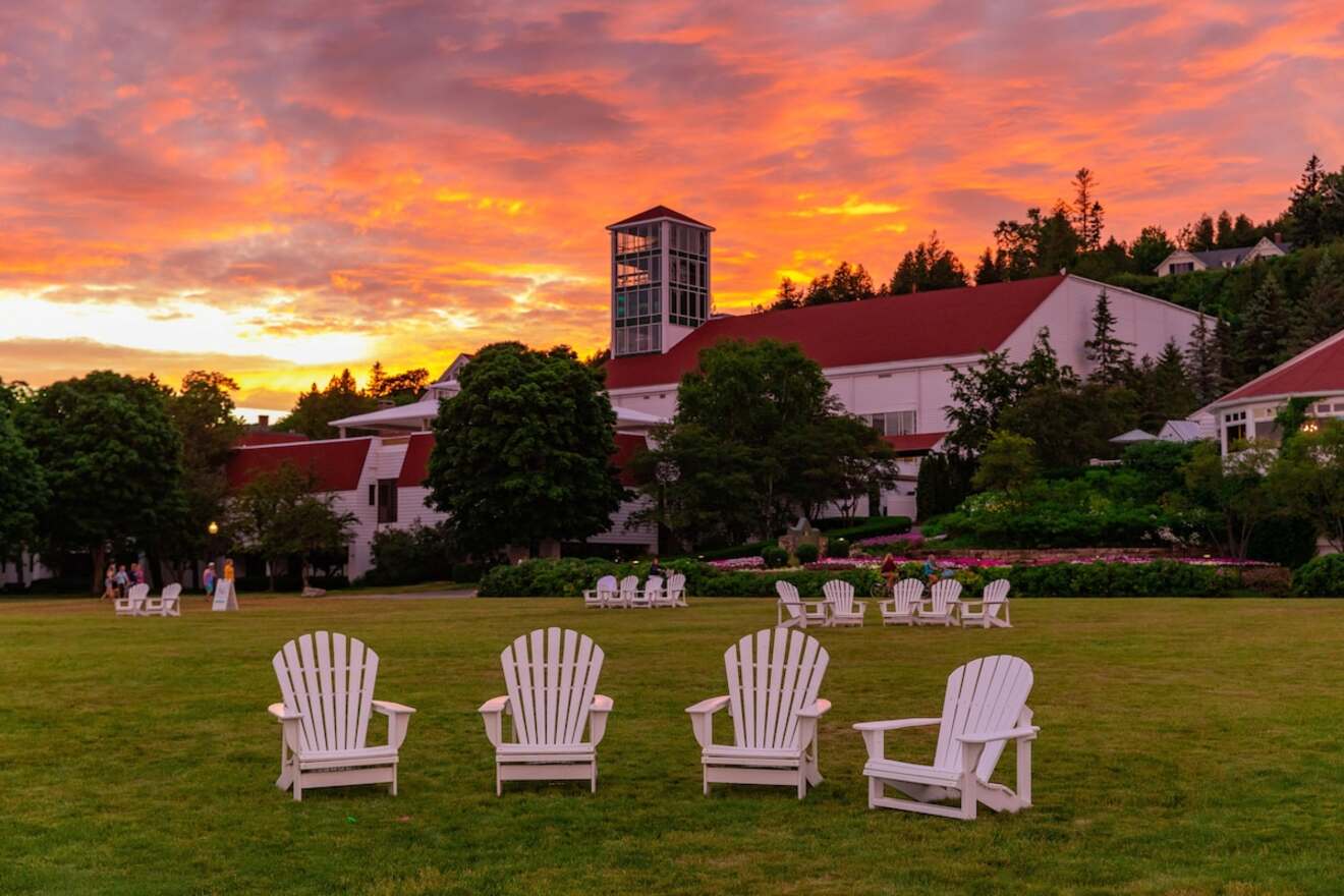 lounge chairs in grass with sunset in the background