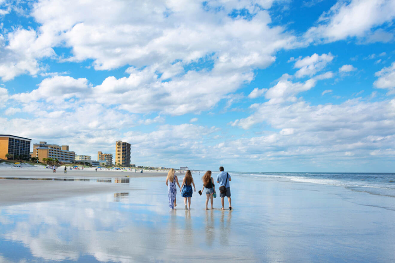 group of friends walking on the beach