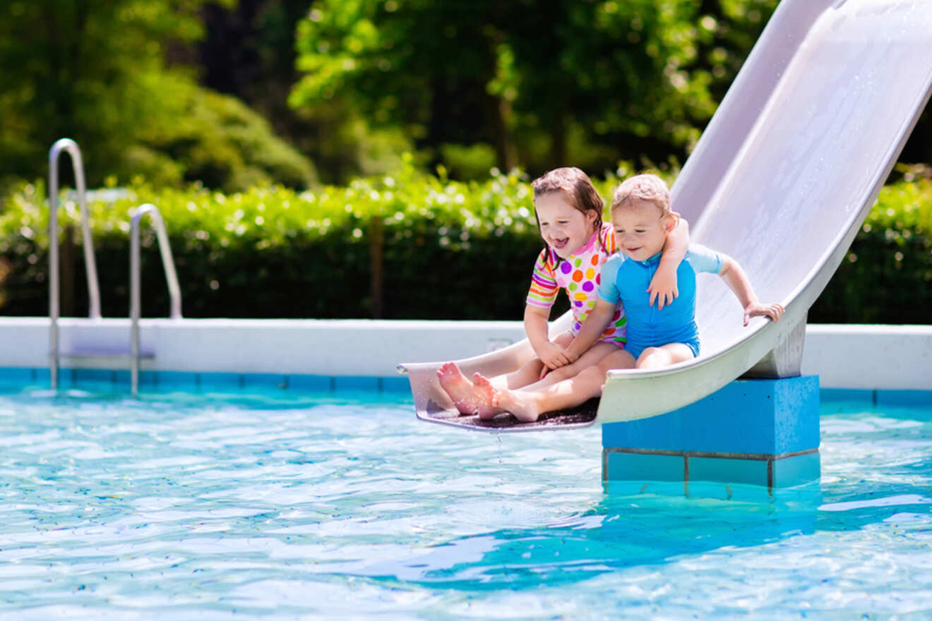 Two children going down a waterslide
