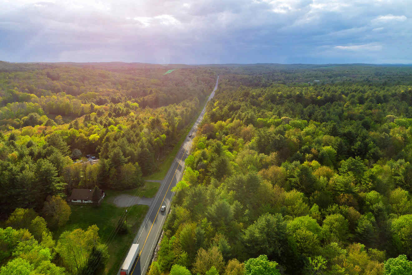 aerial view over a road and forest in Poconos