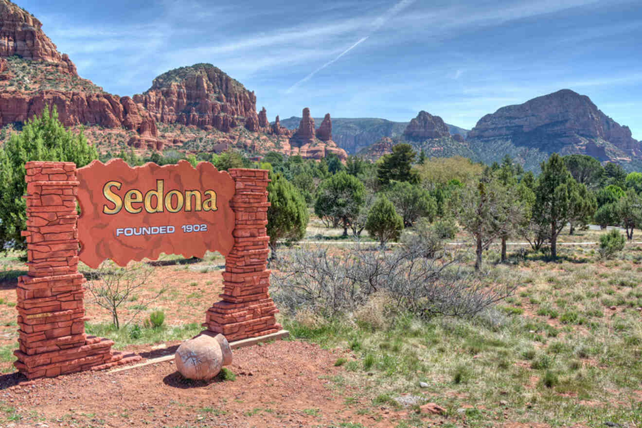 A sign saying: "Sedona, founded 1902" near a canyon