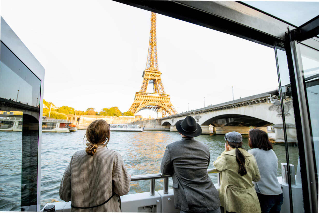 people watching the Eiffel Tower from a cruise boat