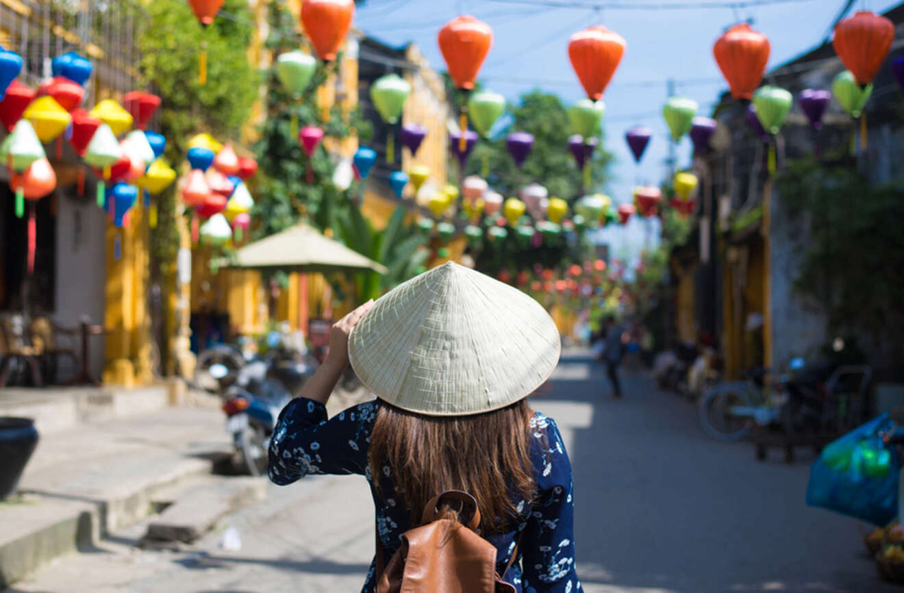 woman with an asian hat walking on the street