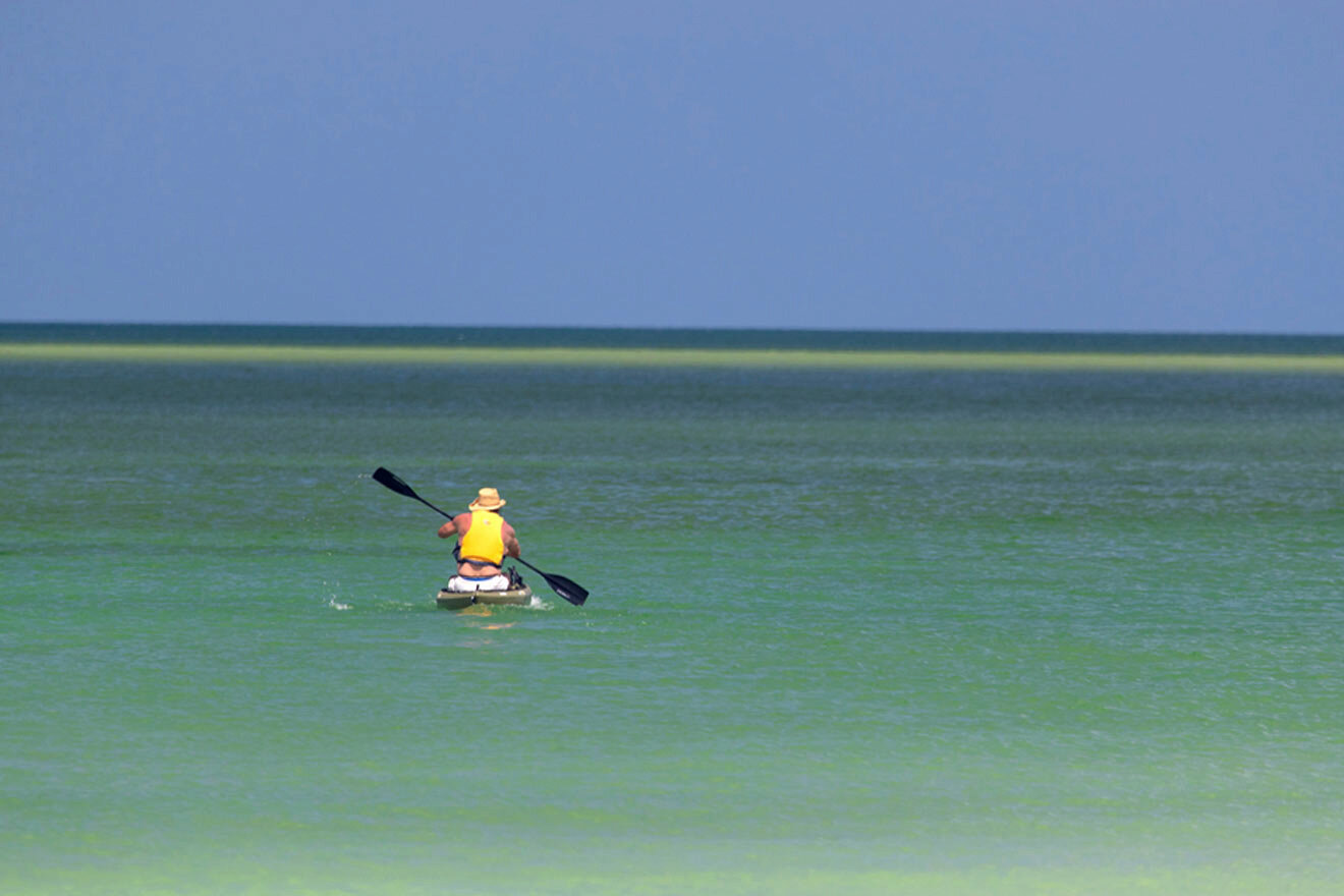 man kayaking in the sea