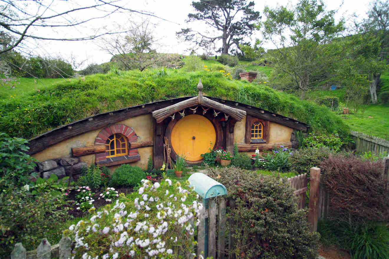 a house with a green roof and a yellow door