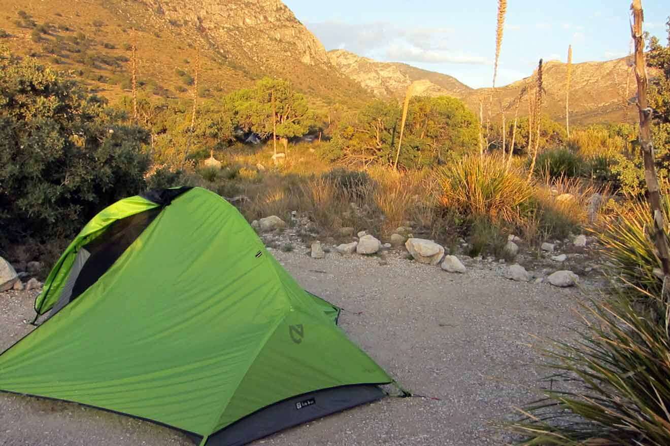 a green tent in campground