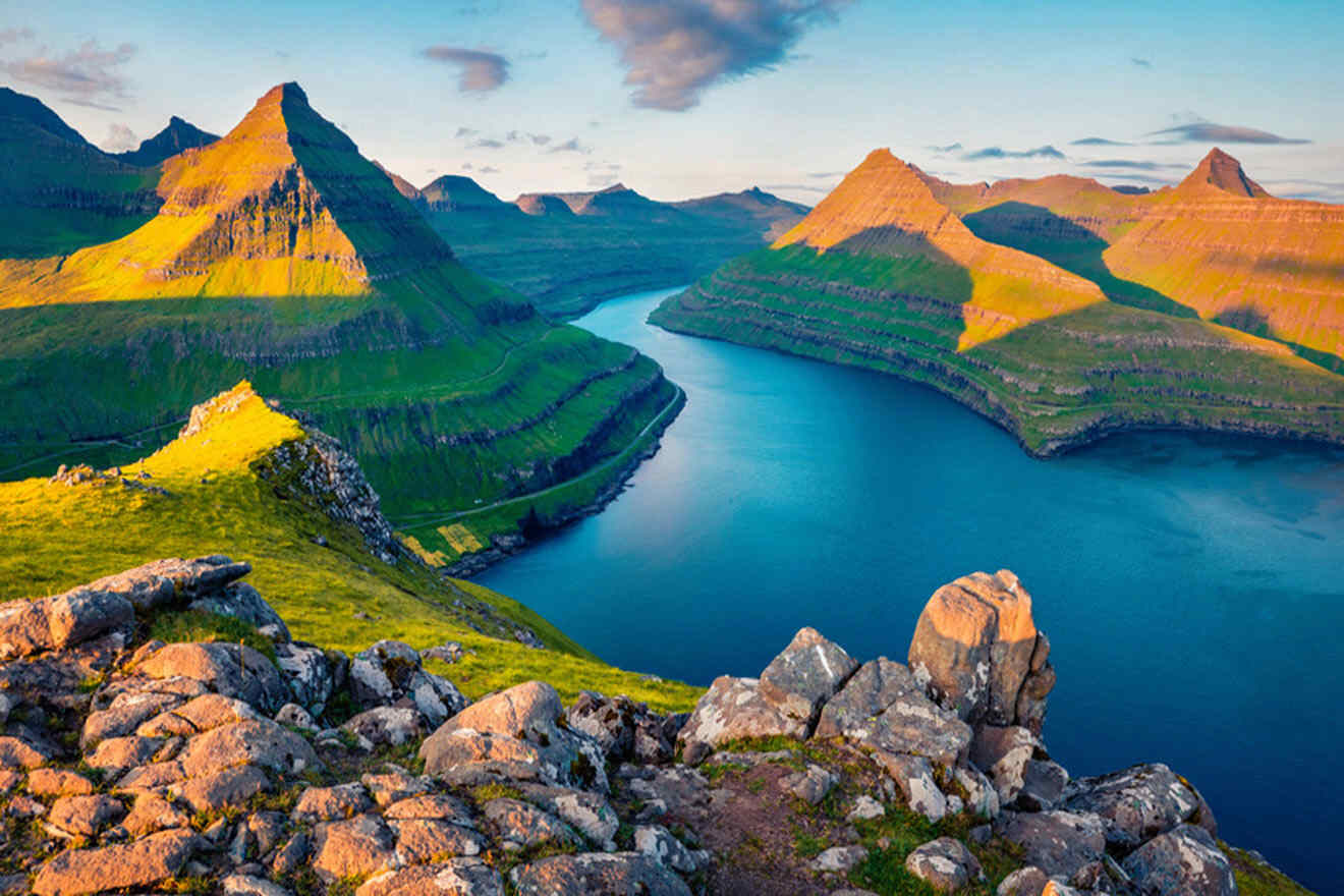 a scenic view of a lake surrounded by mountains