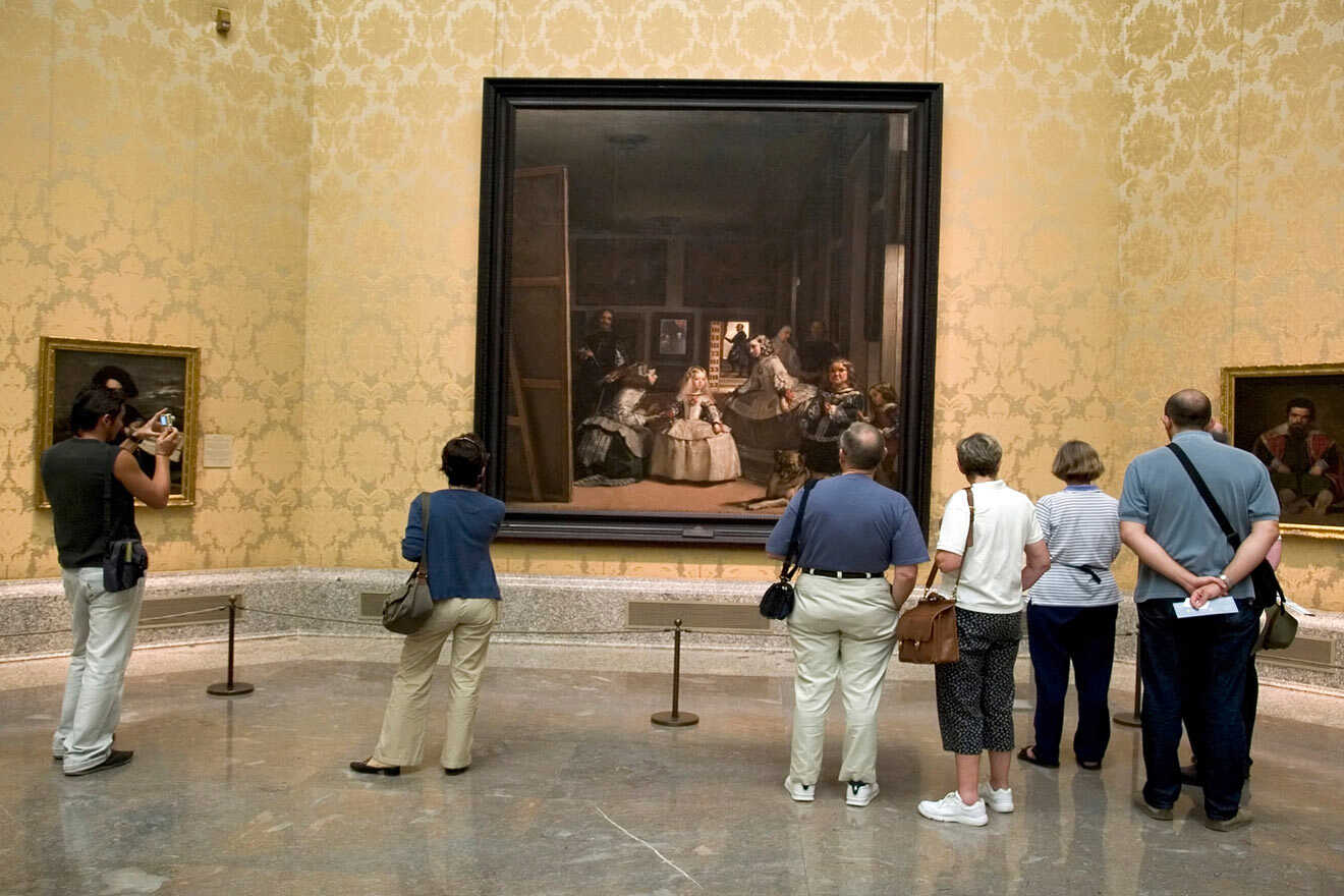 people watching art at Prado Museum