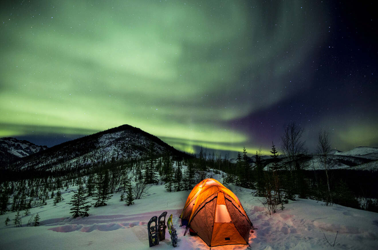 A tent under northern lights