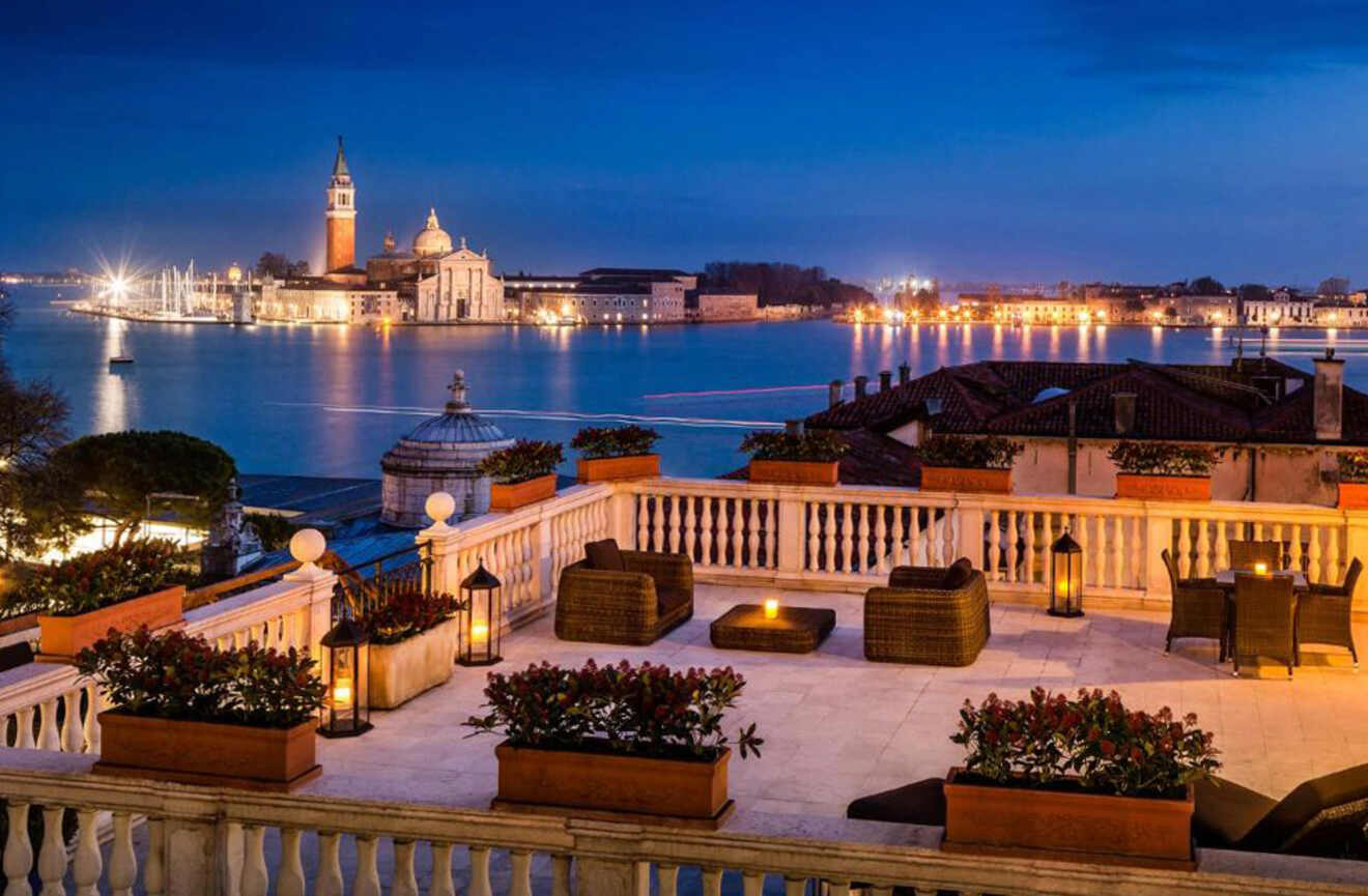 a balcony overlooking a body of water at night