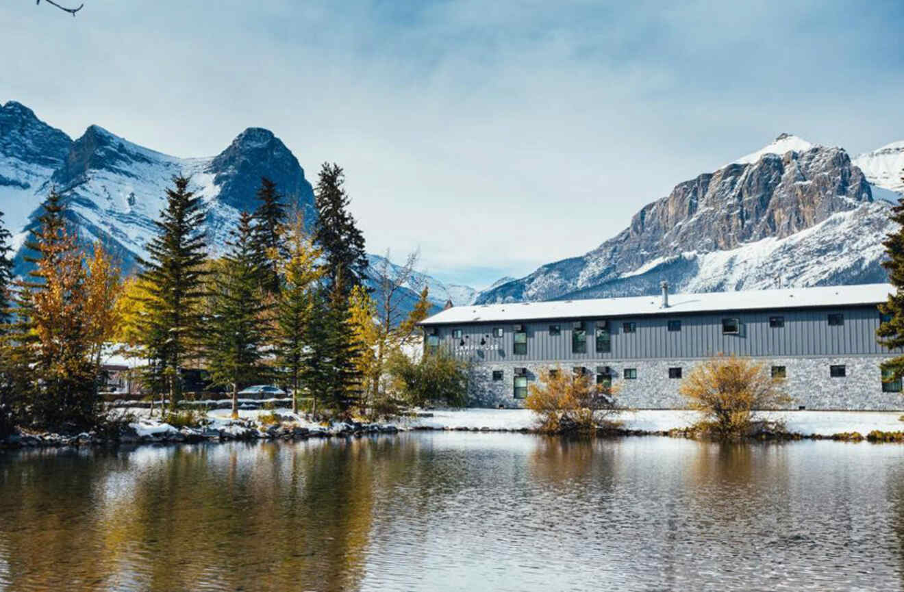 View of hotel by the lake with mountains in the background