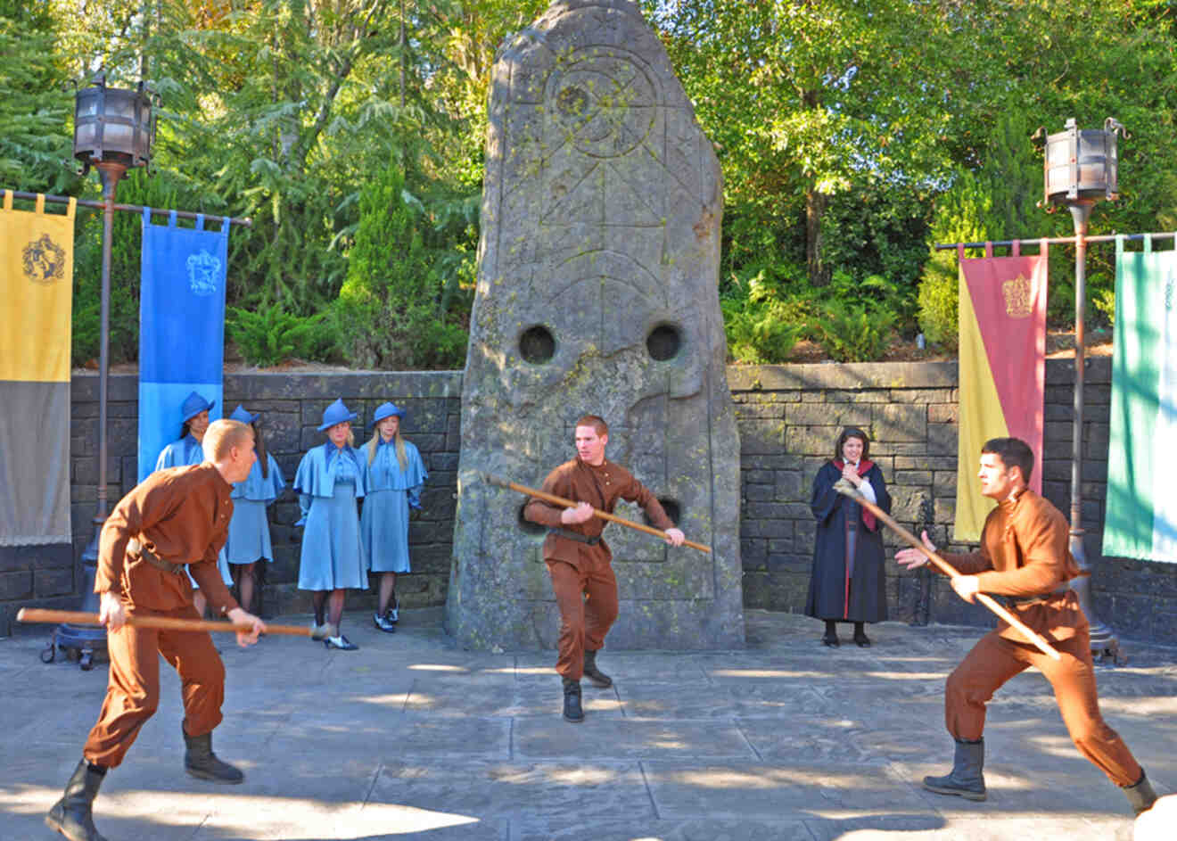 People dressed as wizards performing a show