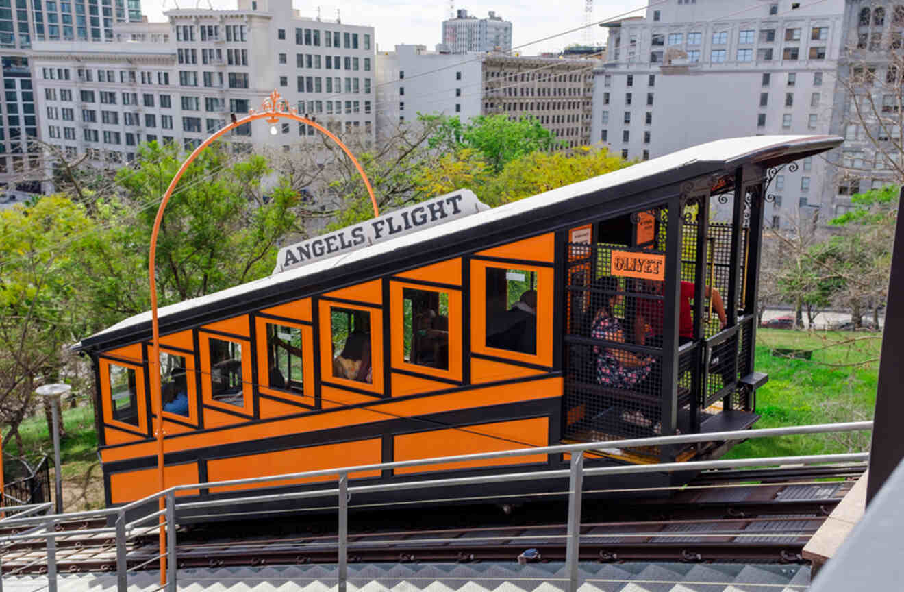 an orange trolley car on a city street