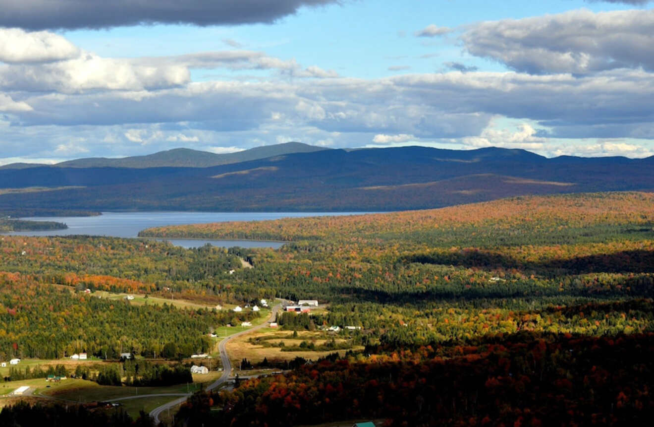 a scenic view of a lake surrounded by mountains